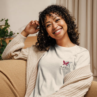 Relaxed, smiling woman in a cozy K-AROLE branded t-shirt