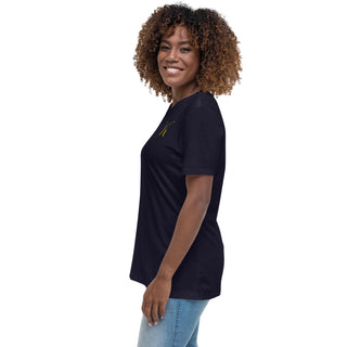 Smiling woman with curly brown hair wearing a black t-shirt