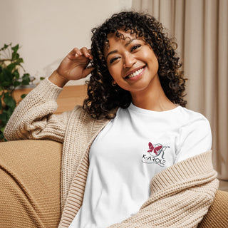 Smiling woman wearing K-AROLE brand relaxed t-shirt with floral logo, showcasing trendy casual fashion.
