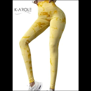 Yellow and white printed yoga pants from the K-AROLE fashion brand, showcasing a trendy, high-quality sportswear design.