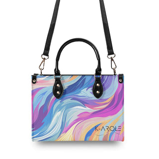 Stylish swirling design handbag with bold, vibrant colors. Durable leather construction with adjustable shoulder straps. Fashionable accessory for women's athleisure outfits from the K-AROLE brand.