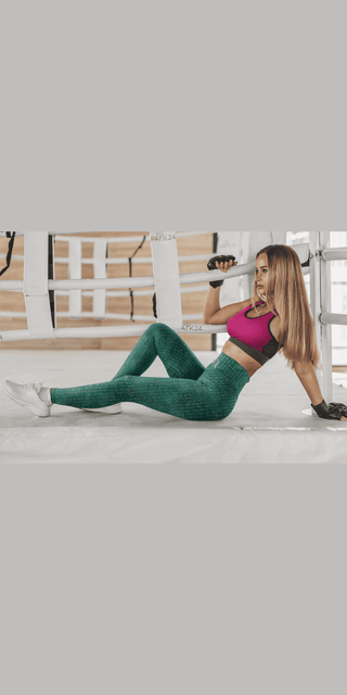 Stylish athletic leggings worn by a fitness-focused woman working out in a home gym setting