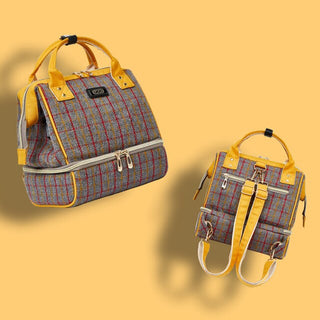 Stylish and functional diaper bag backpack with plaid pattern, multiple pockets, and insulated compartment for storing baby essentials on the go.