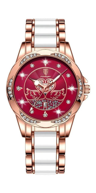 Elegant rose gold-tone women's watch with a red dial featuring a decorative floral pattern and crystal accents. The watch has a sleek, modern design with a metal bracelet and a subtle, feminine style suitable for casual or formal wear.