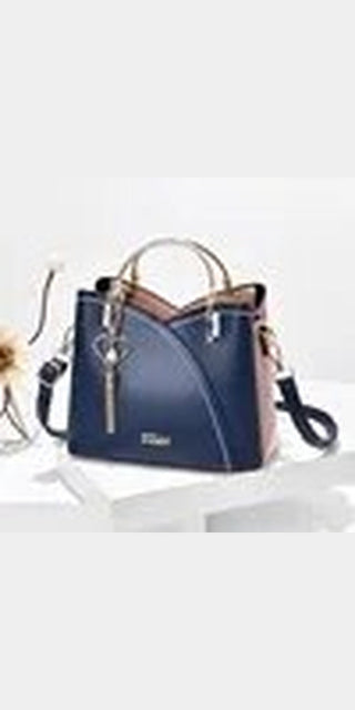 Stylish women's patchwork handbag in navy blue color with leather strap and tote design, showcasing a fashionable and functional accessory.
