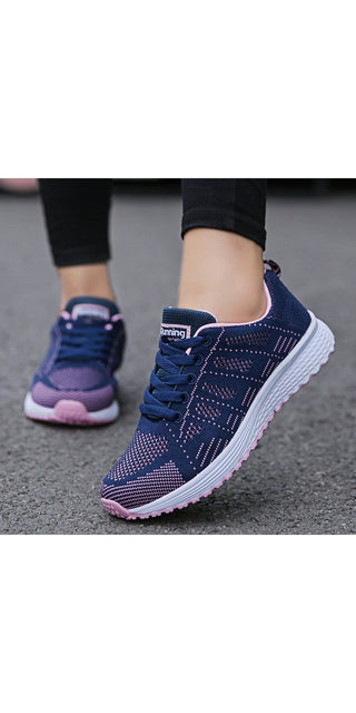 Stylish women's casual sneakers with breathable mesh fabric and comfortable athletic design. Vibrant navy blue color and sleek vulcanized sole for modern, sporty look.