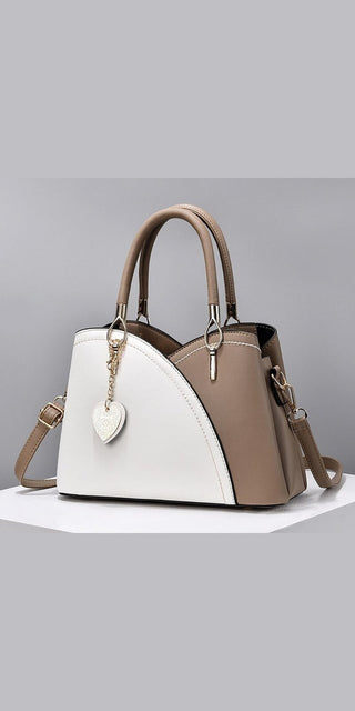 Stylish patchwork handbag with block handle and large capacity for fashionable women.