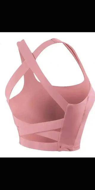 Stylish pink sports bra for active women. Strappy, supportive design for comfortable workouts.