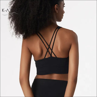 Cross-back sports push-up yoga bra from K-AROLE with a strappy, supportive design and black color.