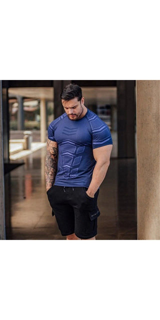 Muscular male model in blue compression t-shirt, posing outdoors