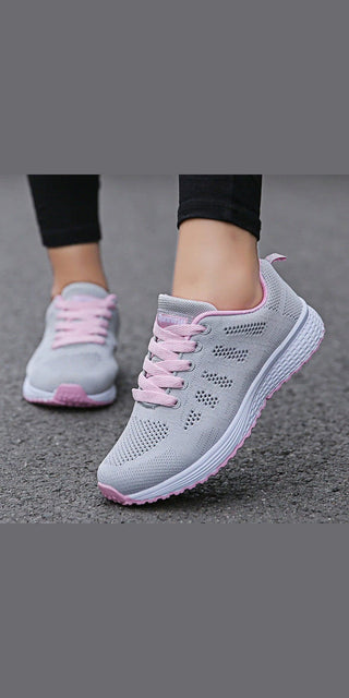 Stylish women's casual mesh sneakers with a breathable design, perfect for walking and gym workouts, featuring a sleek gray and pink color scheme.