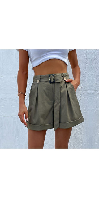 Fashionable green high-waisted women's shorts with a stylish belt, displayed against a gray background.