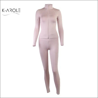 Fitted legging and jacket set from K-AROLE, featuring a soft pink color scheme and a sleek, comfortable design for active wear.