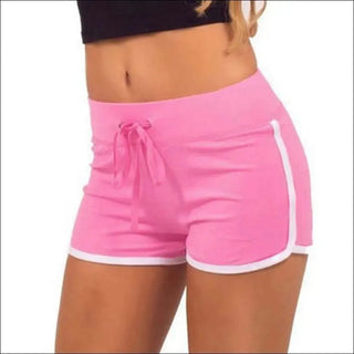 Bright pink athletic shorts with contrasting white trim, featuring a drawstring waist for adjustable fit.