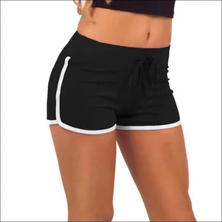 Stylish black and white athletic shorts with drawstring waistband and contrast trim, ideal for a casual yet chic workout look.