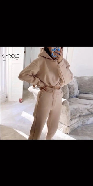 Stylish K-AROLE™️ women's 2-piece jogging suit with taupe leggings and hoodie, showcased in a clean, minimalist setting.