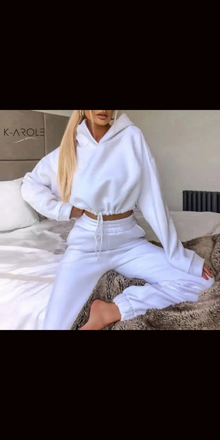 Cozy white K-AROLE™️ women's 2-piece jogging suit with hooded top and matching leggings for a stylish athleisure look.