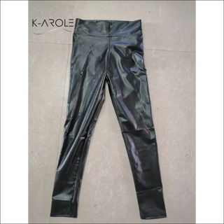 Stylish PU leather leggings by K-AROLE, featuring a sleek, glossy black finish and a streamlined silhouette for a polished, fashion-forward look.