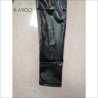 Sleek K-AROLE™️ PU leather leggings with minimalist branding