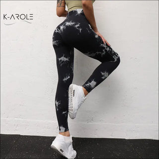 Stylish K-AROLE™️™️ seamless yoga tights with bold tie-dye pattern, designed for comfort and sport.