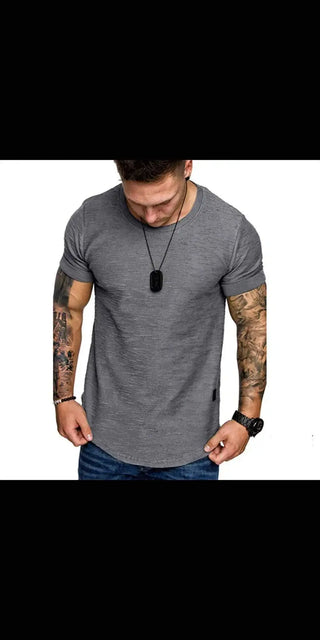 Stylish men's casual t-shirt with tattoos and necklace, showcasing modern urban fashion.