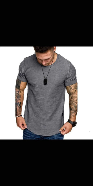 Gray casual t-shirt with muscular tattooed arms