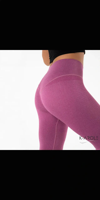 Sports tight yoga pants from K-AROLE's women's fashion collection. Featuring a vibrant pink hue and a sleek, form-fitting silhouette to accentuate the wearer's figure.