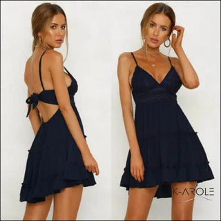 Elegant navy blue mini dress with bow tie shoulders, perfect for an evening out, showcased by two models posing in front of a white background.