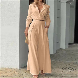 Stylish beige maxi dress with pockets, worn by a fashionable woman against a white background at the K-AROLE store.