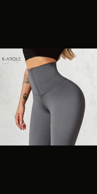 Sleek and stylish grey sports leggings with a high waist from K-AROLE, designed for a flattering fit and optimal comfort during workouts.