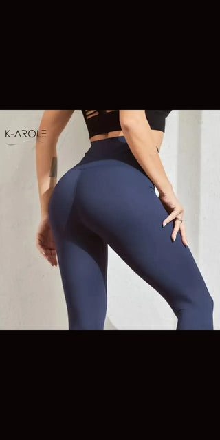 Sleek navy blue sports leggings with a fitted, flattering design from K-AROLE's trendy activewear collection.