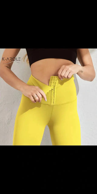 Vibrant yellow leggings with sleek, slim silhouette from K-AROLE sportswear brand.