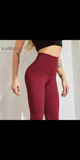 Stylish maroon sports leggings from K-AROLE featuring a high-waisted design for a flattering and slimming look.