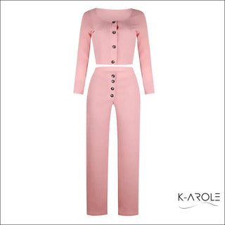 Chic women's ribbed long sleeve set in soft pink, featuring a structured top with front buttons and matching wide-leg pants for a stylish yet comfortable look.