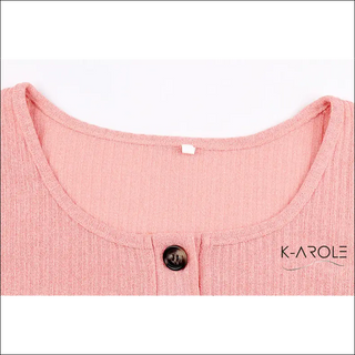 Elegant pink women's sweater with button detail showcasing the K-AROLE brand logo, a high-quality fashion retailer offering trendy and comfortable clothing and accessories.